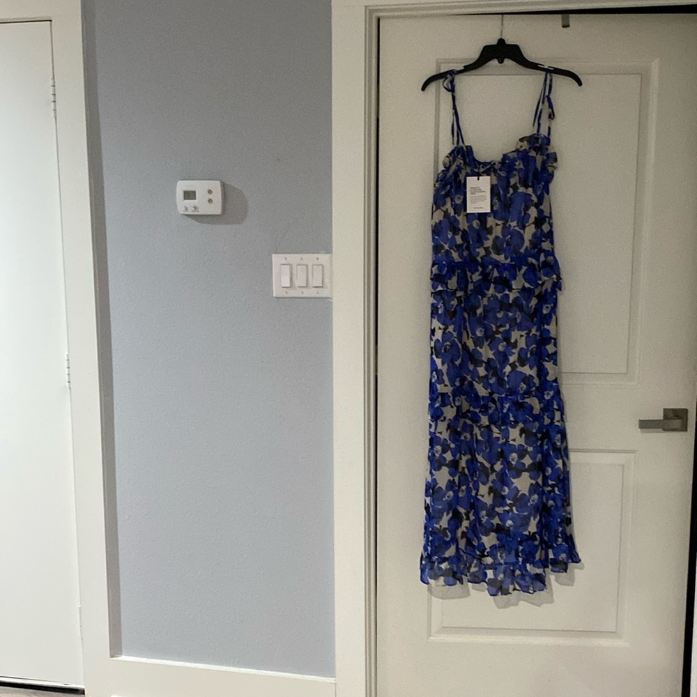Pretty woman’s floral long  dress with tied shoulder strings in midi length